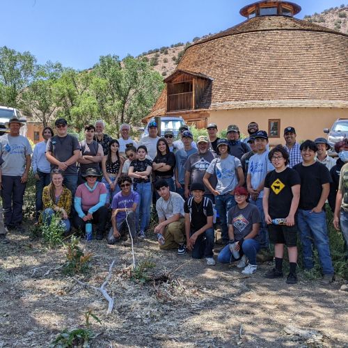 A large group of participants gather for a picture to commemorate the Watershed Academy Youth Interns Meetup at Ojo Caliente, New Mexico.